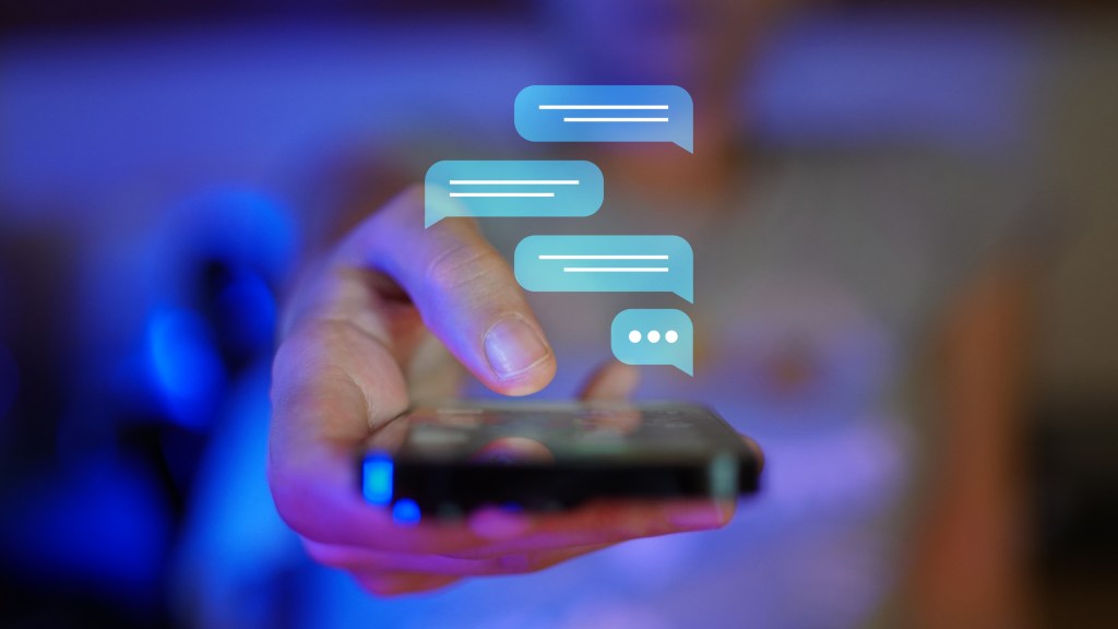 A person holding a smartphone with illustrated text message bubbles above it, indicating communication through text messaging.